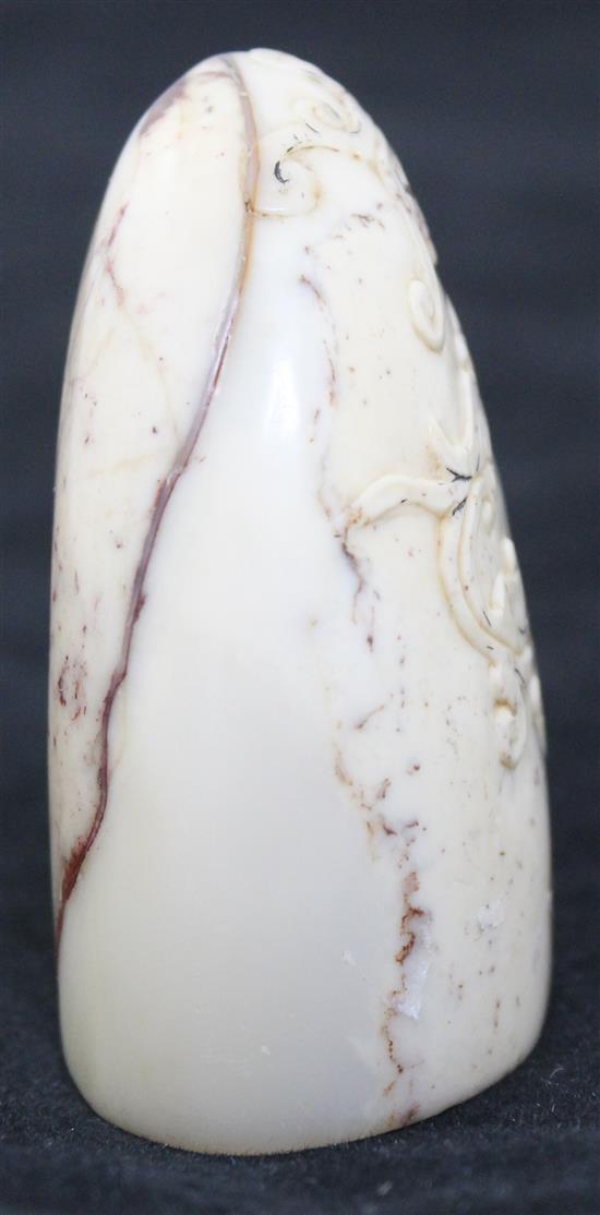 A Chinese cream and red soapstone seal, 6.3cm